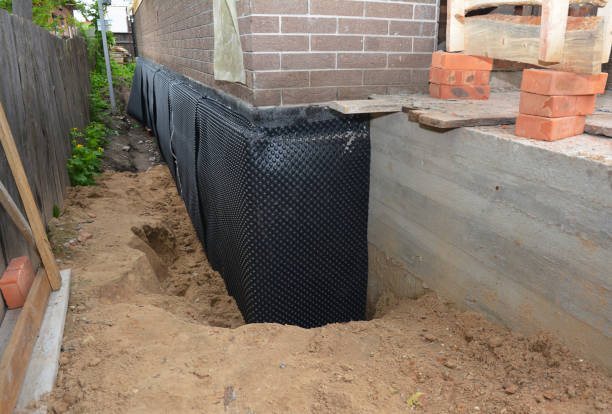 SJ Waterproofing Pros technician performing targeted Exterior Waterproofing assessment in Laura, OH